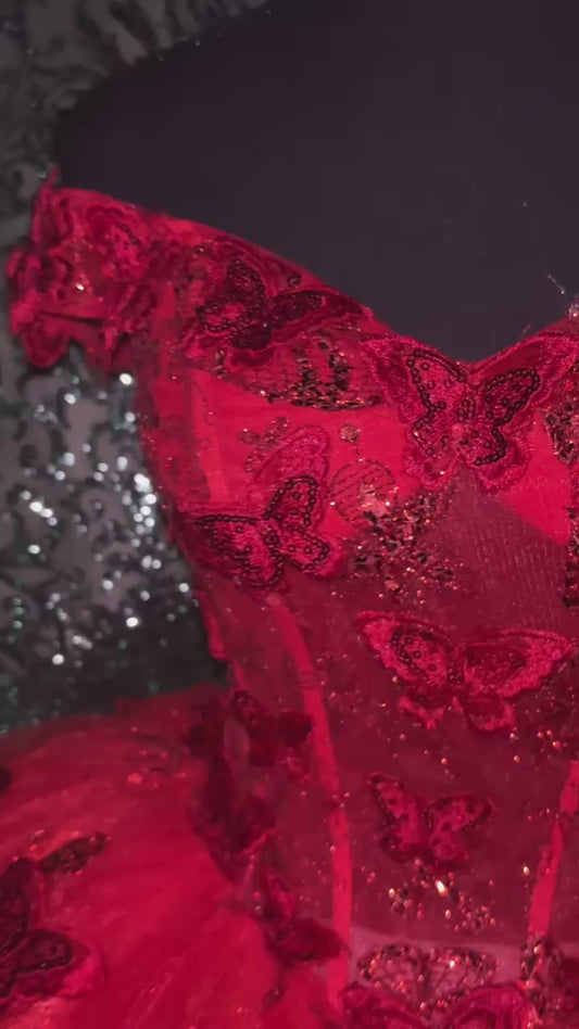 Red quinceañeras dresse with butterflies