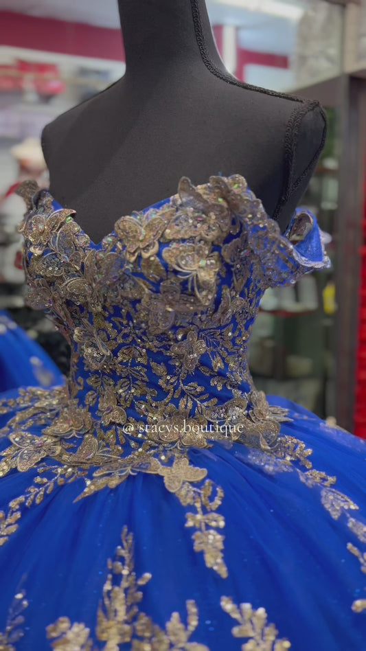 Royal blue dresse with gold butterfly’s
